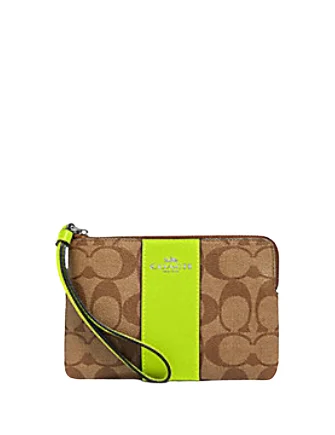 Coach Corner Zip Wristlet In Signature Canvas